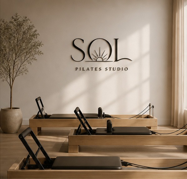 Sol Pilates Studio logo on studio wall